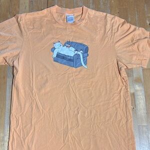 Ripndip Peach Tshirt with cat on couch